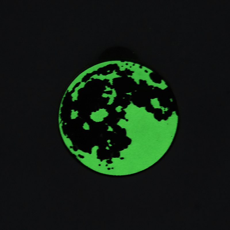 enamel pin of the glowing full moon. 